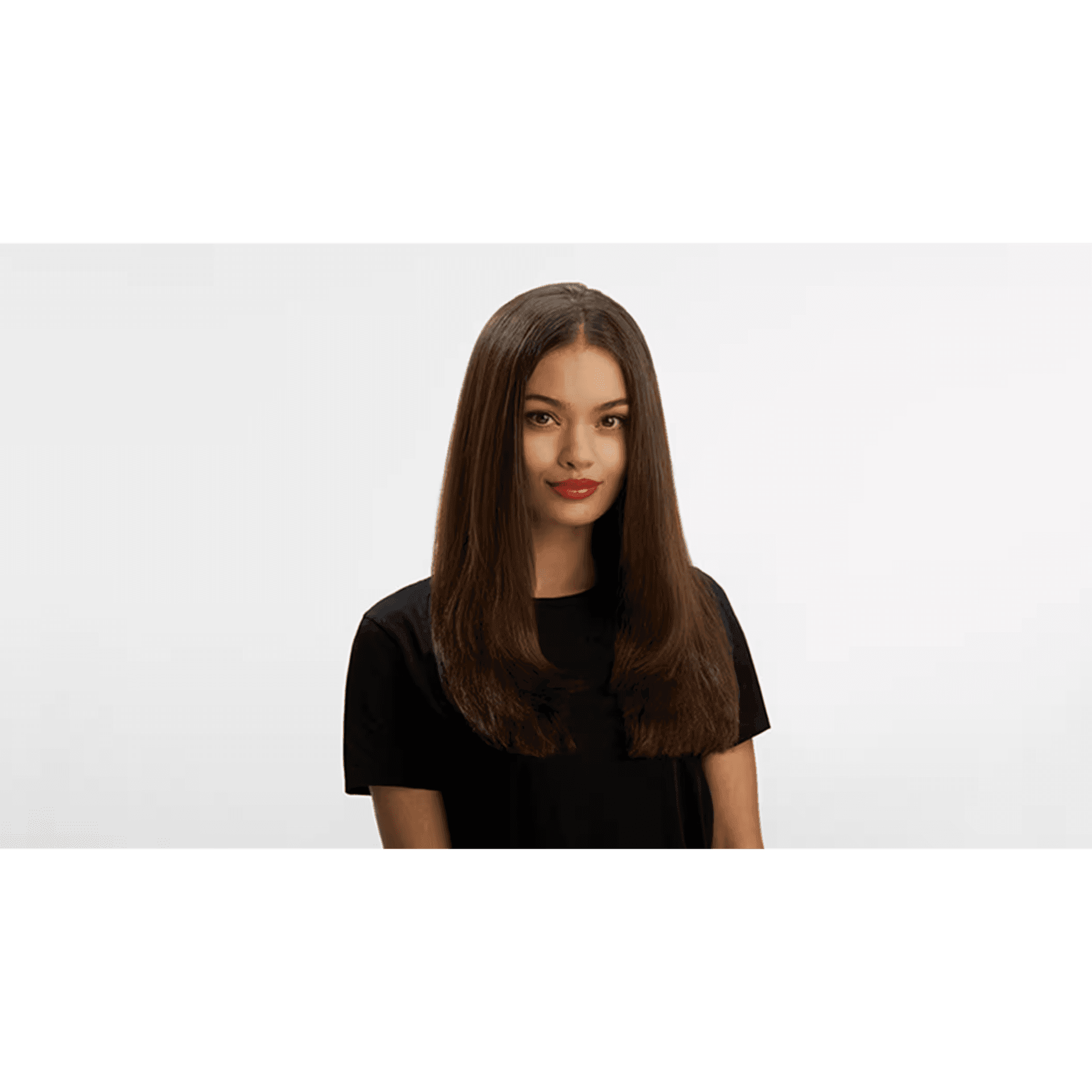 Person with long brown hair and red lipstick wearing a black shirt against a white background.