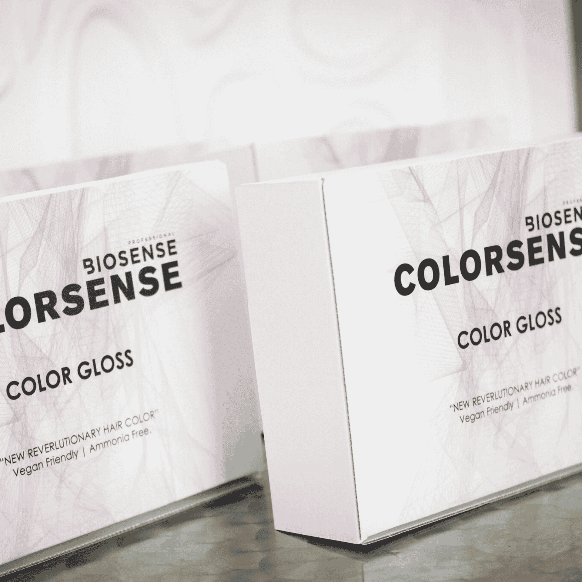 Boxes of Biosense COLORSENSE Color Gloss, vegan and ammonia-free hair product.