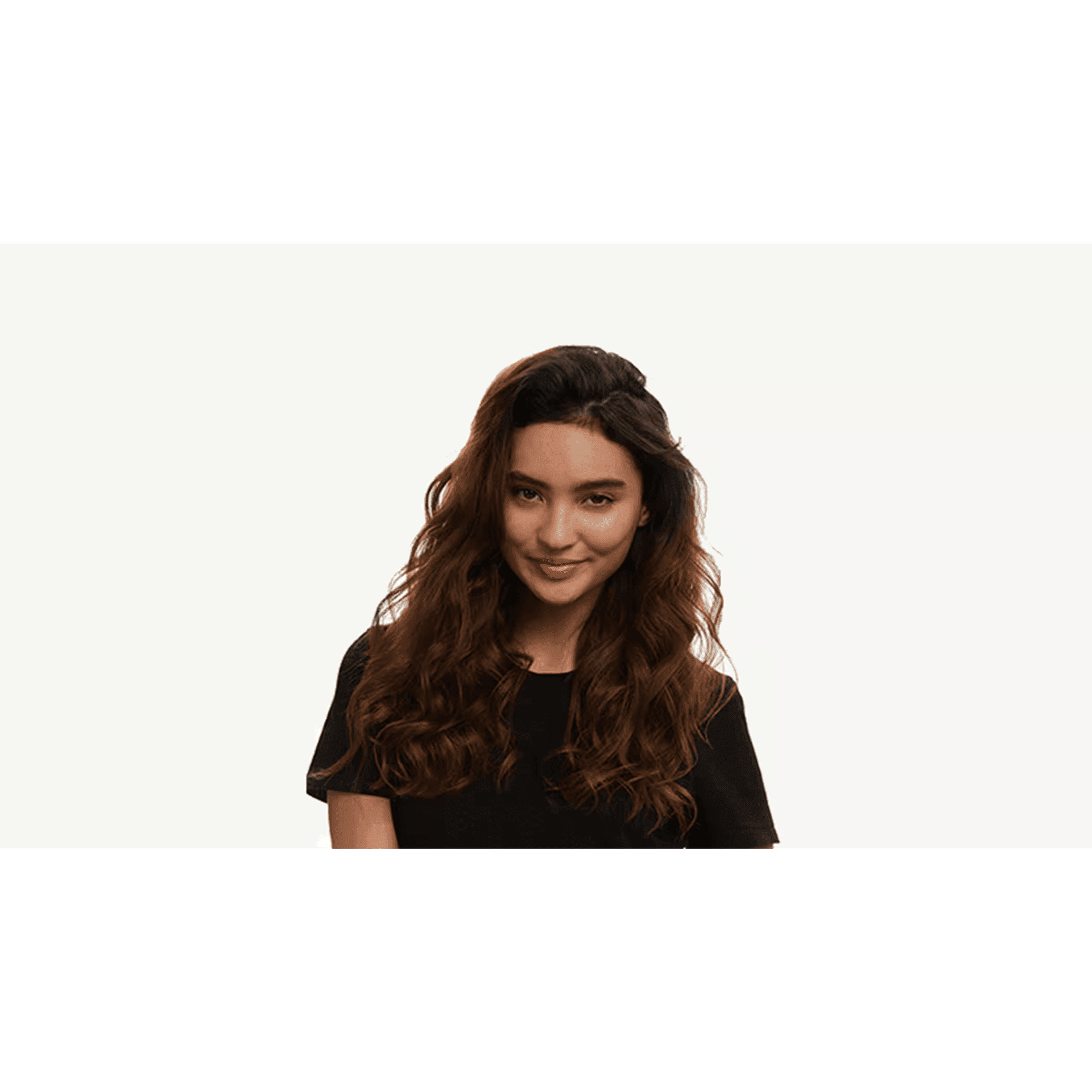 Person with long wavy brown hair, wearing a black top, against a plain white background.